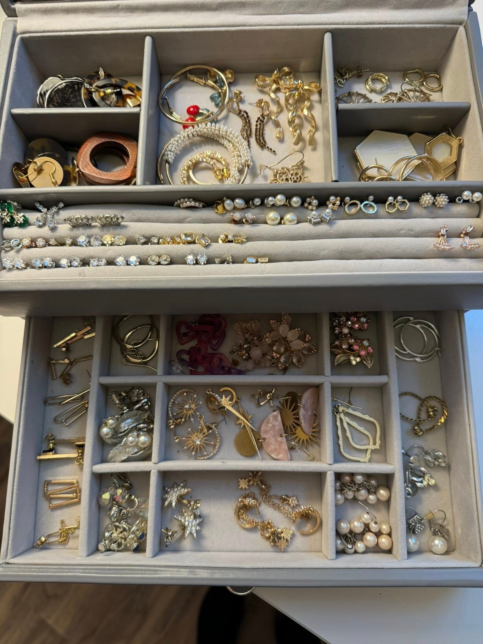 Jewelry collection organized in display boxes by Bay Area Professional Organizer Kiera Rain, Walnut Creek CA